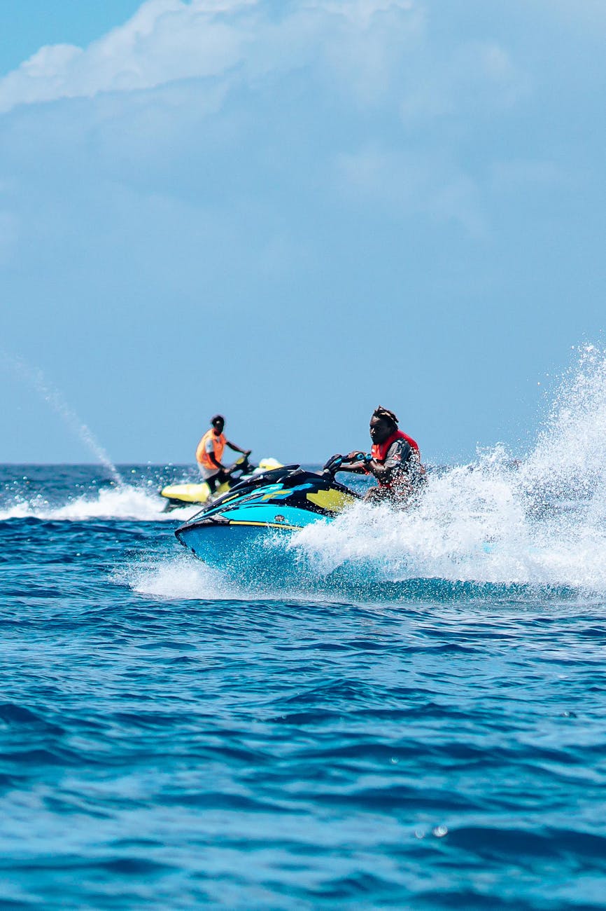 people riding jet ski