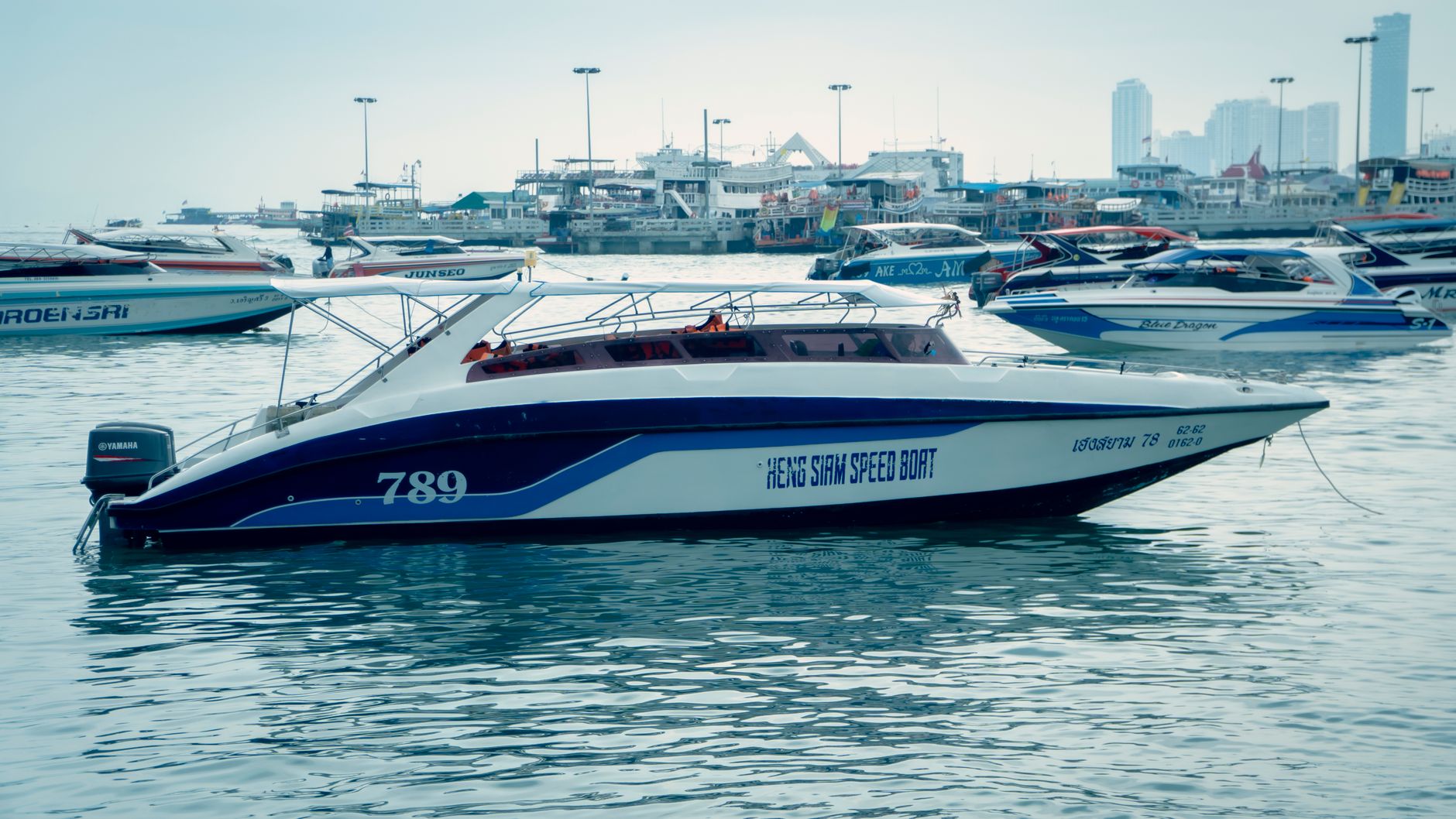 speedboat docked at bustling marina